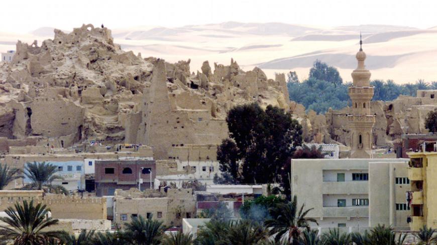 A view showing the 2,500-year-old ruins of Shally, the old city
standing above the new city known as Siwa, at the edge of the western
desert February 4, 2002. The oasis has about 230 hot and cold mainly
fresh water springs, and several large lakes scattered around the area,
which is a popular destination for tourists on desert safari trips.
REUTERS/Aladin Abdel Naby

AN/WS - RTR1849