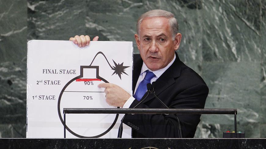 Israel's Prime Minister Benjamin Netanyahu points to a red line he has drawn on a graphic of a bomb used to represent Iran's nuclear program as he addresses the 67th United Nations General Assembly at the U.N. Headquarters in New York, September 27, 2012. The red line he drew represents a point where he believes, the international community should tell Iran that they will not be allowed to pass without intervention. REUTERS/Lucas Jackson (UNITED STATES - Tags: POLITICS) - RTR38I72