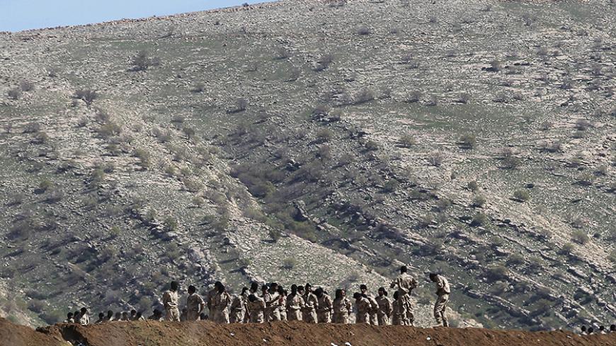 Volunteers to fight the Islamic State, from different Iraqi factions including Kurdish and Yazidis, train at a camping area near Kurdish security points on Bashiqa mountain, around 15km Northeast of the Islamic State held city of Mosul, March 7, 2015. REUTERS/Asmaa Waguih (IRAQ - Tags: CIVIL UNREST) - RTR4SFUI