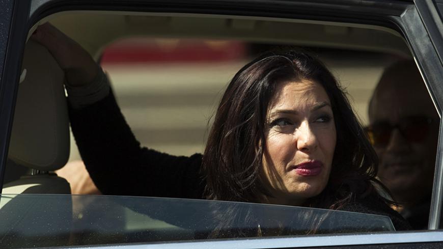 Likud legislator Miri Regev, a former brigadier general and political hardliner of Moroccan origin, looks out a car window during a campaign stop in Netanya, north of Tel Aviv February 25, 2015. Israel's Sephardic community, Jews of Middle Eastern descent, have traditionally been the Likud party's backbone. But political analysts say Sephardim, disproportionately poorer than Israel's Ashkenazi Jews with roots in Europe, may throw their support elsewhere in the March 17 election, angry over the high cost of