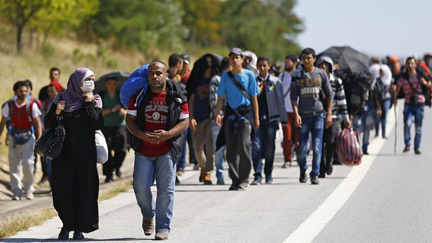 Syrian migrants walk towards the Greece border on a road near Edirne, Turkey, September 15, 2015. REUTERS/Osman Orsal - RTS165C