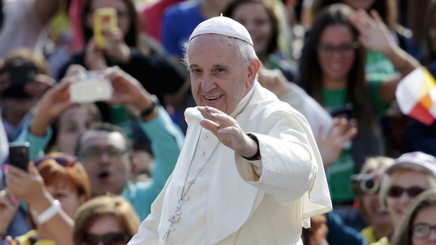 Pope Francis waves as he arrives to lead his Wednesday general audience in Saint Peter's Square at the Vatican, September 9, 2015. REUTERS/Max Rossi - RTS911