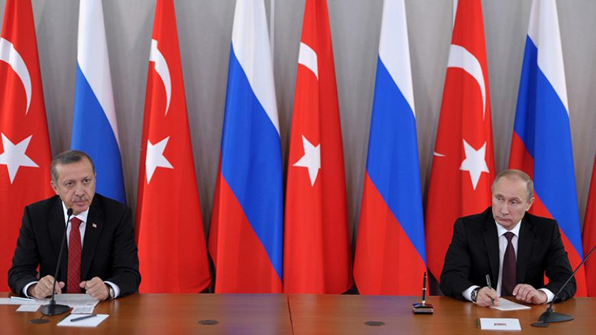 Russian President Vladimir Putin (R) attends a news conference with Turkish Prime Minister Tayyip Erdogan in Strelna near St. Petersburg, November 22, 2013. Putin said on Friday Western states must persuade the Syrian opposition to attend talks with President Bashar al-Assad's government which he said should take place as soon as possible.  REUTERS/Aleksey Nikolskyi/RIA Novosti/Kremlin (RUSSIA - Tags: POLITICS CONFLICT) 

ATTENTION EDITORS - THIS IMAGE HAS BEEN SUPPLIED BY A THIRD PARTY. IT IS DISTRIBUTED, 