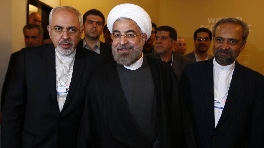 Iran's President Hassan Rouhani, Foreign Minister Mohammad Javad Zarif (L) and Mohammad Nahavandian the Head of Iran Presidential Office (R) arrive for a meeting during the annual meeting of the World Economic Forum (WEF) in Davos January 22, 2014.                   REUTERS/Denis Balibouse (SWITZERLAND  - Tags: POLITICS BUSINESS TPX IMAGES OF THE DAY)   - RTX17PZ0