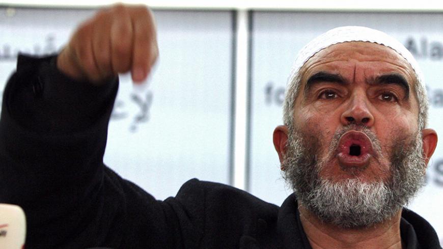 Sheikh Raed Salah, head of the Arabic Israeli Islamic Movement, speaks during a press conference at an east Jerusalem hotel, on March 10, 2008. The Arab Israeli Islamic Movement spoke about threats it says Israeli works in the Jerusalem Old City pose to the Al-Aqsa mosque compound. AFP PHOTO/AHMAD GHARABLI (Photo credit should read AHMAD GHARABLI/AFP/Getty Images)