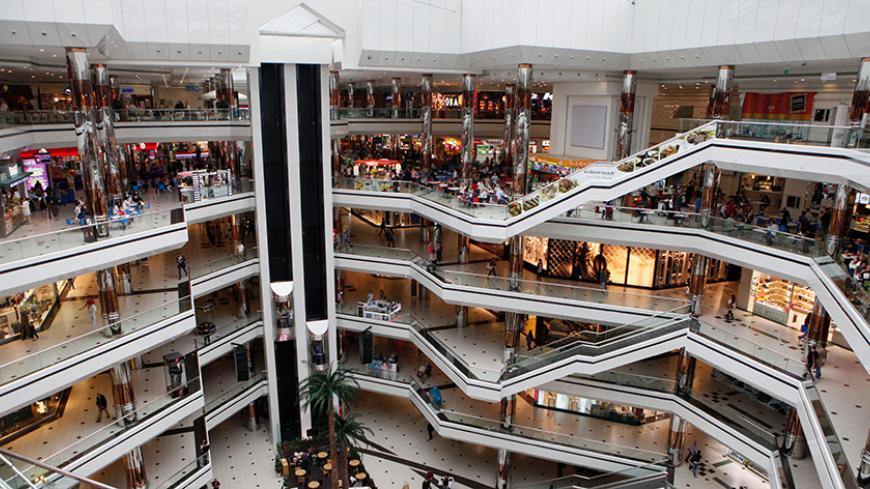 People stroll at a shopping mall in Istanbul October 10, 2011. In a country where per capita incomes are up 40 percent since 2001, consumer's hunger for goods and services is explosive. The $735 billion economy grew 8.8 percent in the second quarter of 2011, faster than India?s and more than four times the pace of the euro zone. Loans, corporate profits and sales of cars and electronics are still rising at double-digit clips. Picture taken October 10, 2011. To  match Analysis TURKEY-STOCKS/ REUTERS/Murad Se