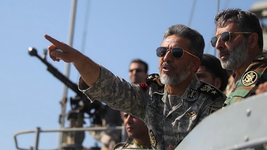 Iran's Navy commander Habibollah Sayyari (C) points while standing on a naval ship during Velayat-90 war game on Sea of Oman near the Strait of Hormuz in southern Iran January 1, 2012. Iran test-fired a new medium-range missile, designed to evade radars, on Sunday during the last days of its naval drill in the Gulf, the official IRNA news agency quoted a military official as saying. REUTERS/Fars News/Hamed Jafarnejad (IRAN - Tags: POLITICS MILITARY) THIS IMAGE HAS BEEN SUPPLIED BY A THIRD PARTY. IT IS DISTR
