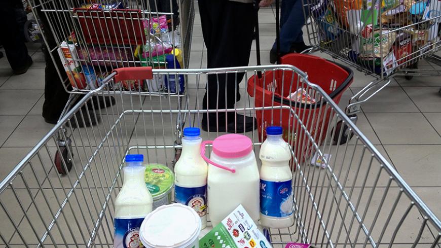 EDITORS' NOTE: Reuters and other foreign media are subject to Iranian restrictions on their ability to film or take pictures in Tehran.
Food items are placed in trolleys as customers stand in line to pay for their goods at a shopping mall in northwestern Tehran February 3, 2012. With just a month to go before a parliamentary election, Iran has been hit hard in recent months by new U.S. and European economic sanctions over its nuclear programme, which Tehran says is peaceful but the West says is aimed at mak