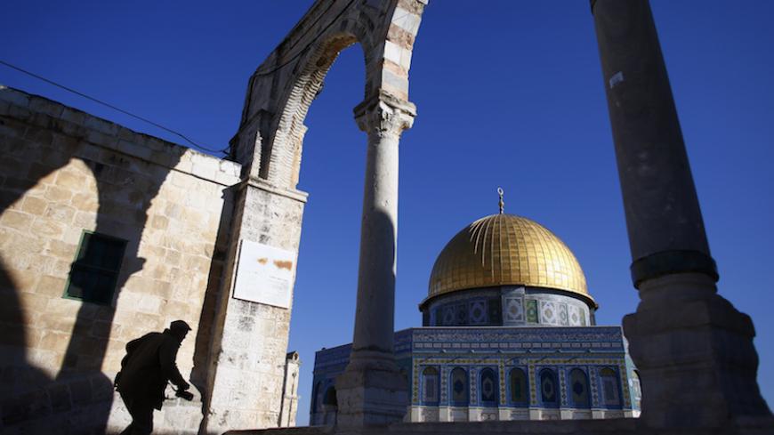 A man climbs the steps leading to the Dome of the Rock, on the compound known to Muslims as Noble Sanctuary and to Jews as Temple Mount, in Jerusalem's Old City November 28, 2012. Jerusalem's Old City is holy to the world's three major monotheistic religions, Judaism, Christianity and Islam. For Jews it incarnates ancient Israel, for Christians it is where Christ spent the last days of his life and for Muslims, it is where the Prophet Mohammad ascended to heaven. REUTERS/Marko Djurica (JERUSALEM - Tags: POL