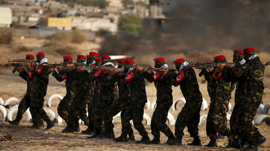 Palestinian militants from al-Husine brigade loyal to Fatah movement is seen during a military-style exercise graduation ceremony in Khan Younis in the southern Gaza Strip, September 20, 2015. REUTERS/Suhaib Salem - RTS20TV