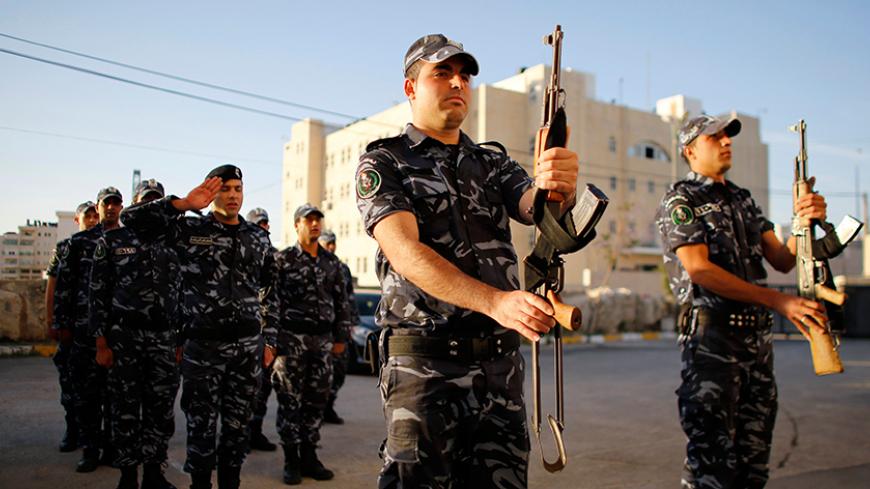 Members of the Palestinian security forces take part in a training session in the West Bank city of Hebron May 22, 2013. Led by the secular Fatah party, the Western-backed PA has pursued surveillance, firings, arrests and torture to bar its Islamist militant rivals Hamas from public life in the West Bank, since the Palestinian territories were split in 2007 when Hamas seized control of the Gaza Strip coastal enclave. Picture taken May 22, 2013. To match Insight PALESTINIANS-HAMAS/CRACKDOWN  REUTERS/Ammar Aw