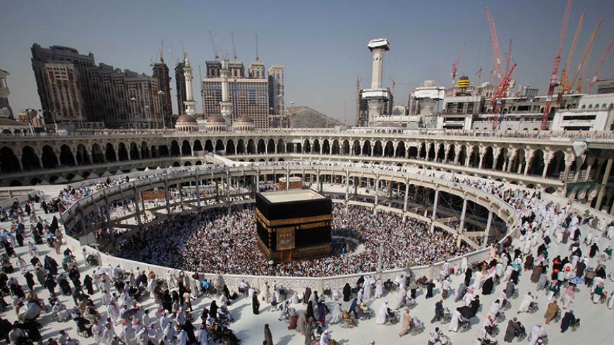 Muslim pilgrims circle the Kaaba at the Grand mosque during the annual Haj pilgrimage, in the holy city of Mecca October 17, 2013. Muslims around the world celebrate Eid al-Adha to mark the end of the Haj by slaughtering sheep, goats, cows and camels to commemorate Prophet Abraham's willingness to sacrifice his son Ismail on God's command. REUTERS/Ibraheem Abu Mustafa (SAUDI ARABIA - Tags: RELIGION) - RTX14EKI