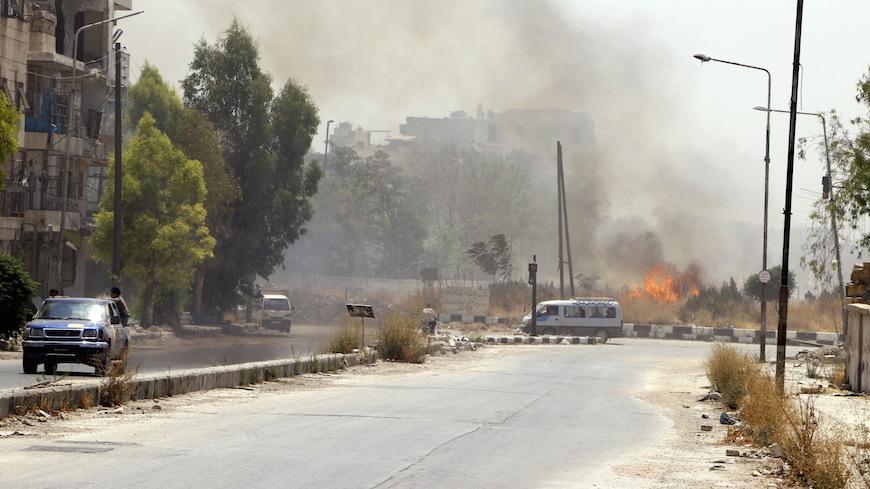 Smoke rises after what activists said was shelling by the forces of Syria's President Bashar al-Assad in Old Aleppo's Kadi Askar area, Syria, August 1, 2015. REUTERS/Abdalrhman Ismail - RTX1MOEZ