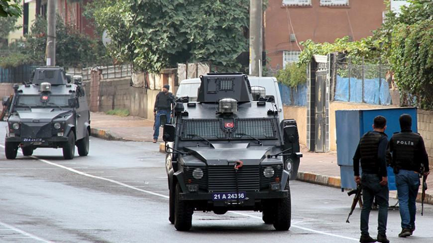 Members of Turkish police special forces take part in a security operation in Diyarbakir, Turkey, October 26, 2015. Two Turkish policemen and seven Islamic State militants were killed in a firefight after police raided more than a dozen houses in Turkey's southeast early on Monday, security sources and government spokesman Numan Kurtulmus said on Monday. The clash took place in the Kayapinar district of the mainly Kurdish city of Diyarbakir. It was the first such shoot-out between Turkish security forces an