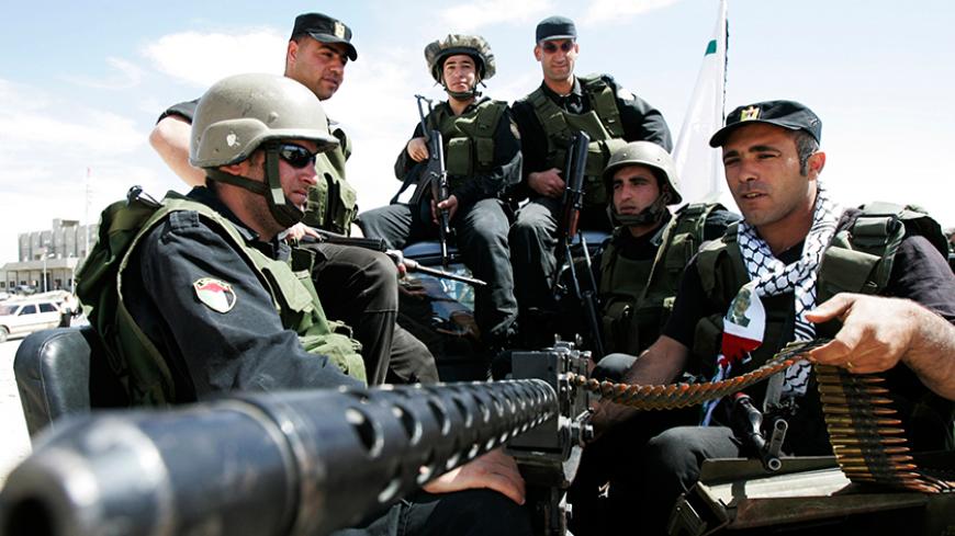 Palestinian security forces participate in a parade during a celebration of the 40th anniversary of the al-Karamah battle, in the West Bank city of Hebron, March 22, 2008. The Al-Karamah battle was fought between PLO (Palestinian liberation Organization) fighters and the Jordanian Army against the Israeli Army in 1968.   REUTERS/Nayef Hashlamoun (WEST BANK) - RTR1YN6M