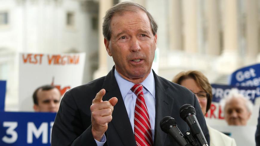 U.S. Senator Tom Udall (D-NM) leads a news conference in support of a proposed constitutional amendment for campaign finance reform, on Capitol Hill in Washington September 8, 2014. Also pictured is Senator Sheldon Whitehouse (D-RI). REUTERS/Jonathan Ernst (UNITED STATES - Tags: POLITICS) - RTR45FBO