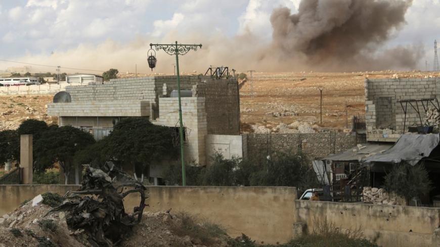 Smoke rises after what activists said were cluster bombs dropped by the Russian air force in the town of Maaret al-Naaman in Idlib province, Syria October 7, 2015. REUTERS/Khalil Ashawi - RTS7DHL