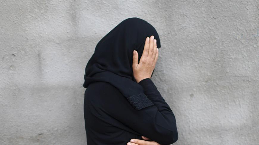 A relative of Palestinian Khalil Obeid, 25, who died on Saturday from a wound he sustained during clashes with the Israeli troops, mourns during his funeral in Khan Younis in the southern Gaza Strip October 25, 2015. Palestinian officials reacted warily on Sunday to what U.S. Secretary of State John Kerry hailed as Jordan's "excellent suggestion" to calm Israeli-Palestinian violence by putting a sensitive Jerusalem holy site under constant video monitoring. REUTERS/Ibraheem Abu Mustafa - RTX1T61F