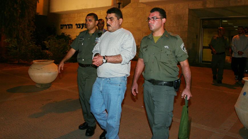 HADARIM PRISON, ISRAEL - JULY 16: In this handout image from Hadarim Prison, Lebanese prisoner Samir Kantar is released by Israeli prison guards on July 16, 2008 at the Hadarim Prison in central Israel. Kuntar, who was jailed in Israel in 1979 at the age of 16 for murder and attempted murder, was swapped in the UN mediated handover with soldiers Eldad Regev, 27, and Ehud Goldwasser, 32. (Photo by Hadarim Prison via Getty Images) *** Local Caption *** Samir Kantar