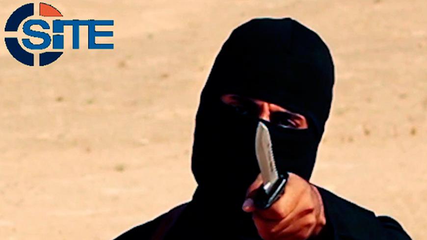 A masked, black-clad militant, who has been identified by the Washington Post newspaper as a Briton named Mohammed Emwazi, brandishes a knife in this still image from a 2014 video obtained from SITE Intel Group February 26, 2015. Investigators believe that the masked killer known as "Jihadi John", who fronted Islamic State beheading videos, is Emwazi, two U.S. government sources said on Thursday. The British government and police refused to confirm or deny his identity, which was first revealed by the Washi