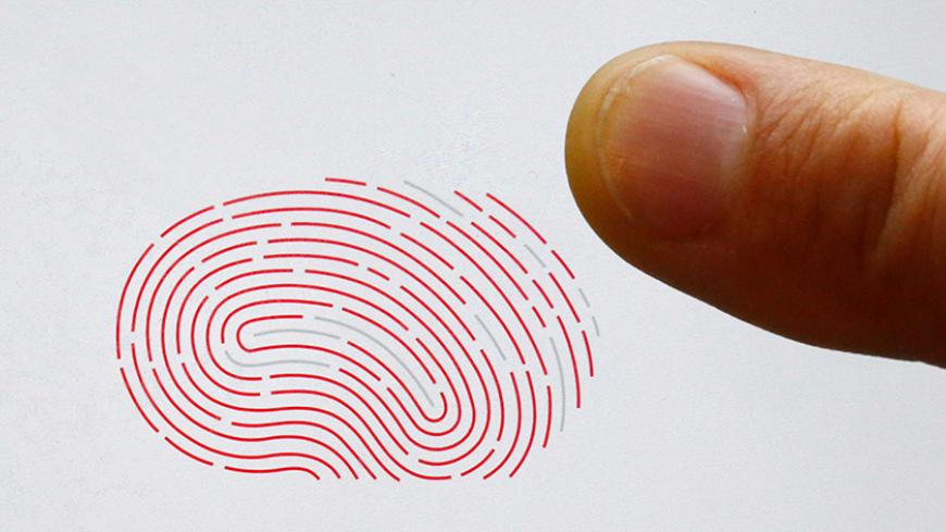 A person uses a sensor for biometric identification on a smartphone in Berlin, Germany October 16, 2015. On the verge of collapse a decade ago, Sweden's Fingerprint Cards (FPC) has emerged market leader in a booming industry set to supply billions of touch fingerprint sensors for smartphones, tablets and credit cards in the years ahead. After years in the wildnerness, plowing cash into product development, the main rival of U.S. Synaptics has seen demand soar in 2015, bagging deals from some of China's bigg