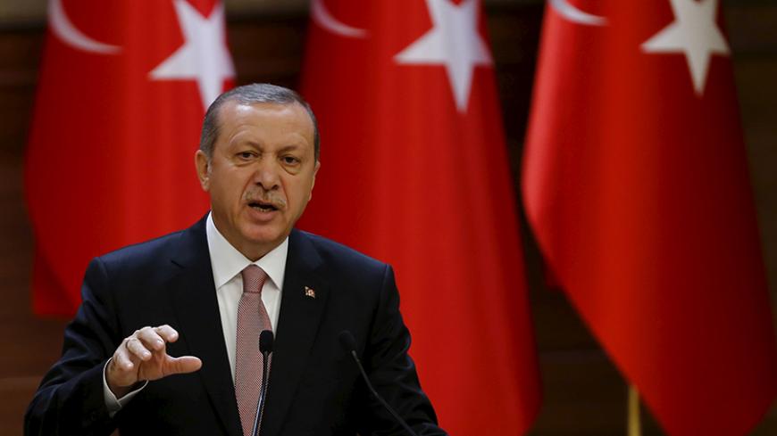 Turkish President Tayyip Erdogan makes a speech during his meeting with mukhtars at the Presidential Palace in Ankara, Turkey, November 26, 2015. Erdogan on Thursday dismissed as "emotional" and "unfitting of politicians" suggestions that projects with Russia could be cancelled in the wake of Turkey's downing of a Russian warplane near the Syrian border. Erdogan said the Russian jet was shot down on Tuesday in an "automatic reaction" in line with standing instructions given to the military. Turkey's militar