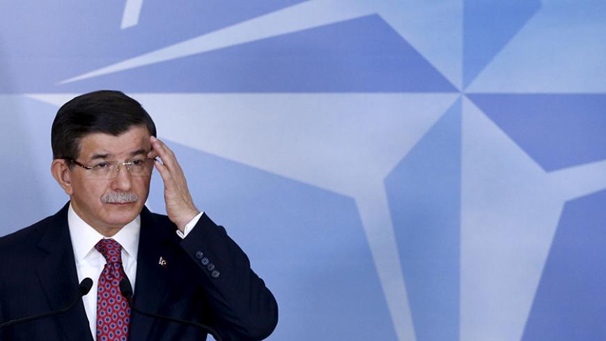 Turkish Prime Minister Ahmet Davutoglu addresses a news conference after meeting NATO Secretary-General Jens Stoltenberg at the Alliance's headquarters in Brussels, Belgium, November 30, 2015. REUTERS/Francois Lenoir - RTX1WHB6