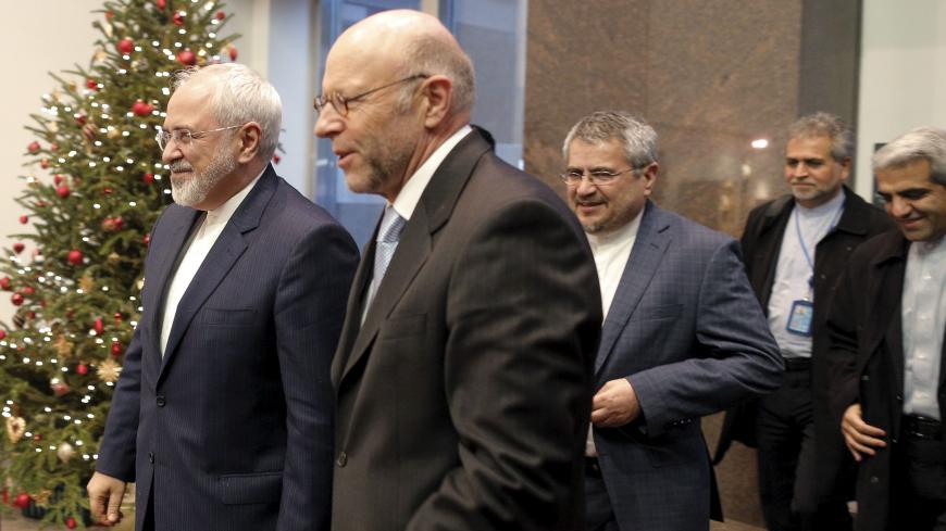 Iranian Foreign Minister Mohammad Javad Zarif (L) is greeted as he arrives at the German Mission to the United Nations in New York, December 17, 2015. REUTERS/Brendan McDermid  - RTX1Z6LJ