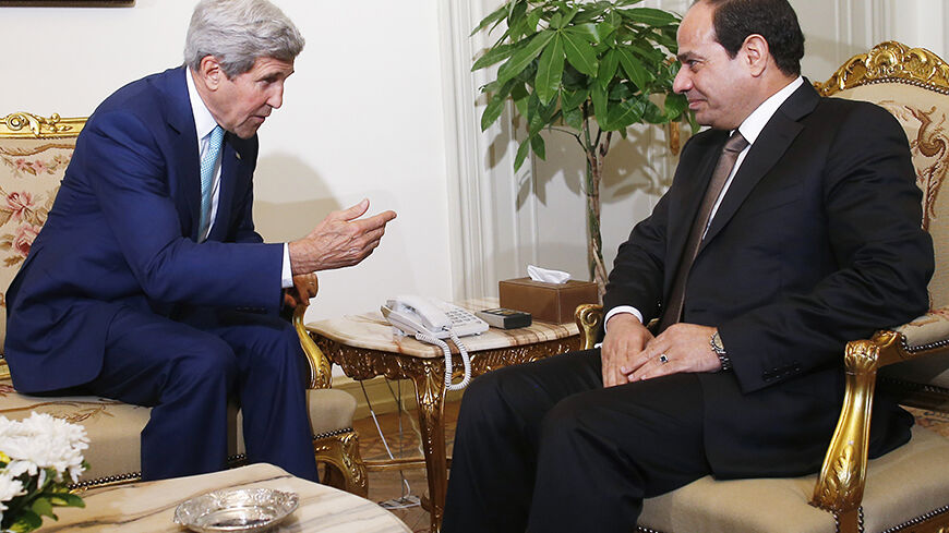 U.S. Secretary of State John Kerry (L) speaks with Egyptian President Abdel Fattah al-Sisi in Cairo July 22, 2014. Israel pounded targets across the Gaza Strip on Tuesday, saying no ceasefire was near as top U.S. and U.N. diplomats pursued talks on halting fighting that has claimed more than 500 lives. Dispatched by U.S. President Barack Obama to the Middle East to seek a ceasefire, Kerry held talks on Tuesday in Cairo with Egyptian Foreign Minister Sameh Shukri.  REUTERS/Charles Dharapak/Pool (EGYPT - Tags