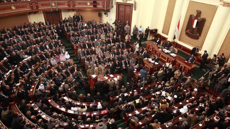 Egypt's newly-elected parliament meets for its first session in Cairo on January 23, 2012. Islamist MPs took centre stage as Egypt's parliament met for the first time since a popular uprising ousted Hosni Mubarak, while their supporters massed outside to cheer the historic event. AFP PHOTO/POOL/ASMAA WAGUIH (Photo credit should read ASMAA WAGUIH/AFP/Getty Images)