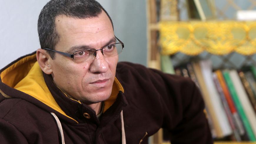 Palestinian journalist Ayman al-Alul answers AFP journalists' questions during an interview on January 13, 2016 at his family home in Gaza City.
Alul, a 44-year-old journalist with the Arab Now news agency, was detained by Hamas security services in the Hamas-run Gaza Strip on January 3 and released on January 11.





 / AFP / MAHMUD HAMS        (Photo credit should read MAHMUD HAMS/AFP/Getty Images)