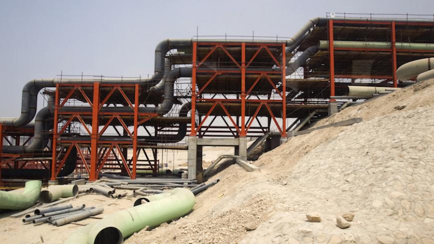 EDITORS' NOTE: Reuters and other foreign media are subject to Iranian restrictions on leaving the office to report, film or take pictures in Iran.

A view of the gas field development section of South Pars Special Economic Energy Zone in Asalouyeh, Seaport, 900 km (560 miles) southwest of Tehran July 19, 2010. REUTERS/Raheb Homavandi (IRAN - Tags: POLITICS ENERGY BUSINESS) - RTR2GJLU