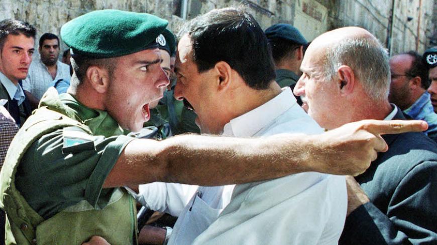 Amit Shabi, an Israeli freelance photographer working for Reuters and
who lives in Sweden, won second place in the general news singles
category of the World Press Photo contest, announced on February 9,
2001, with this picture of an Israeli policeman arguing with a
Palestinian man on October 13, 2000 in Jerusalem. REUTERS/Amit Shabi
GB/CLH/ - RTR9HKN