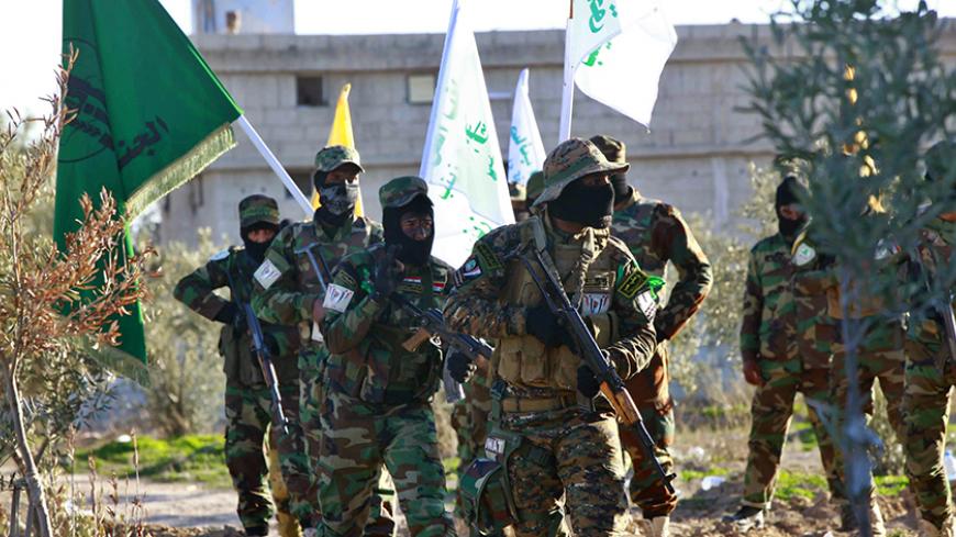 Iraqi Shi'ite fighters demonstrate with their weapons during a military-style training at a camp in on the outskirt of Damascus February 13, 2014.  Picture taken February 13, 2014. REUTERS/Alaa Al-Marjani (SYRIA - Tags: CIVIL UNREST POLITICS CONFLICT) - RTX18VD3