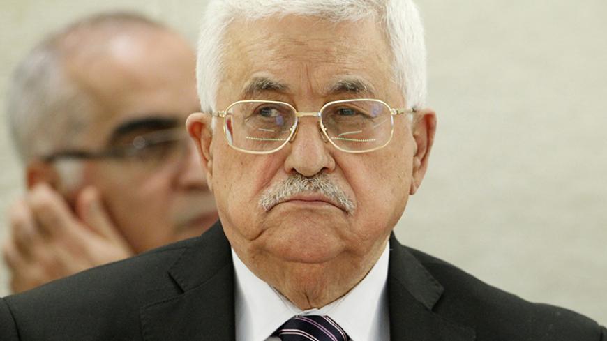 Palestinian President Mahmoud Abbas looks on as he addresses the special meeting of Human Rights Council at the United Nations European headquarters in Geneva, Switzerland October 28, 2015. REUTERS/Pierre Albouy - RTX1TLPI