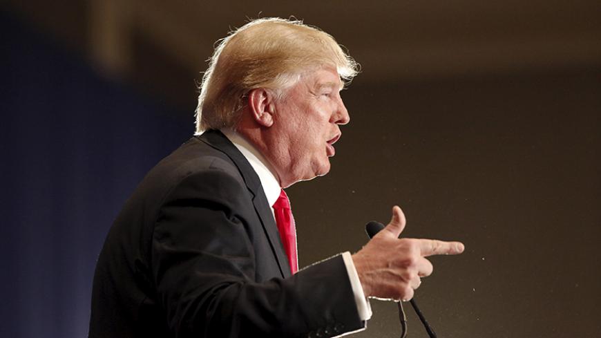 U.S. Republican presidential candidate Donald Trump speaks to supporters at the Westin Hilton Head Island Resort and Spa in Hilton Head Island, South Carolina, December 30, 2015.  REUTERS/Randall Hill - RTX20JLW