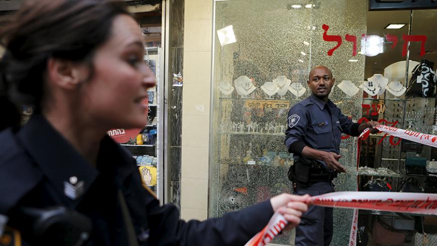 Israeli police officers cordon off the scene of a shooting incident in Tel Aviv, Israel January 1, 2016. One person was killed and several were wounded in a shooting incident in central Tel Aviv on Friday, Israeli media said. A police spokesman confirmed there had been several casualties but would not say if anyone was killed in the incident on Dizengoff Street. REUTERS/Nir Elias - RTX20PRI