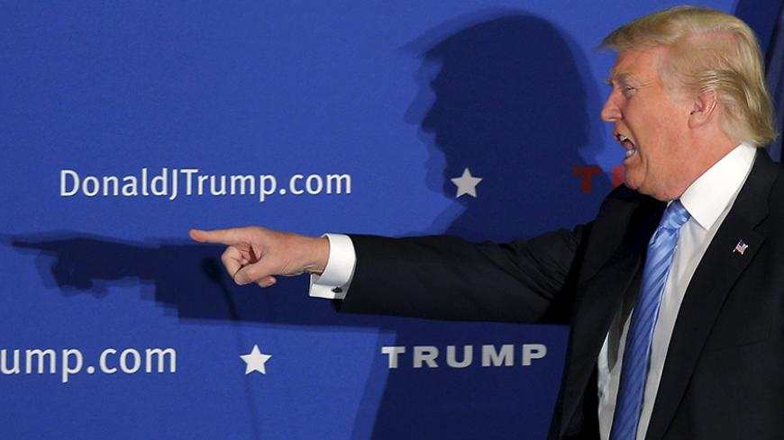 U.S. Republican presidential candidate Donald Trump takes the stage at a campaign rally in Windham, New Hampshire, January 11, 2016. REUTERS/Brian Snyder - RTX21VNU