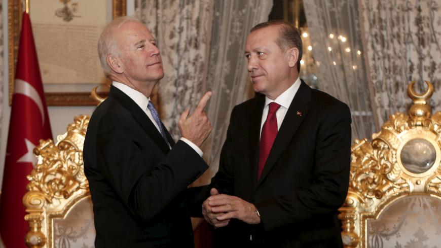 Turkish President Tayyip Erdogan (R) and U.S. Vice President Joe Biden chat after their meeting in Istanbul, Turkey January 23, 2016. REUTERS/Sedat Suna/Pool      TPX IMAGES OF THE DAY      - RTX23P03