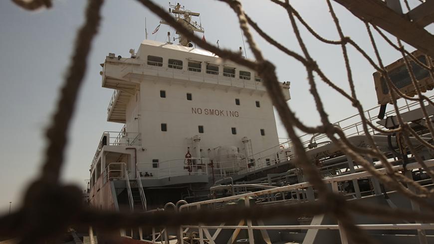 A ship docks at the Bandar Imam Khomeini port in Khuzestan province,1032 km (641 miles) southwest of Tehran, September 28, 2011. REUTERS/Raheb Homavandi  (IRAN - Tags: BUSINESS) - RTR2RYWD