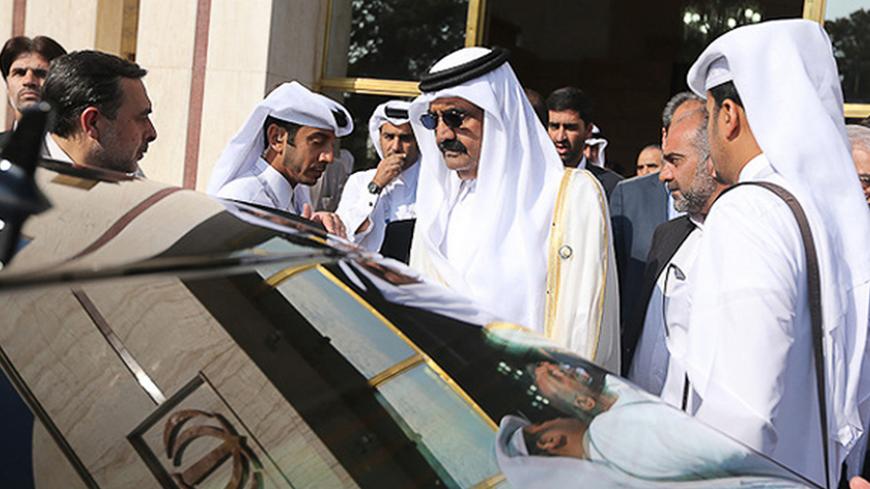 Qatar's Emir Sheikh Hamad bin Khalifa al-Thani (C) arrives in Mehrabad airport ahead of the 16th summit of the Non-Aligned Movement in Tehran, August 30, 2012. REUTERS/Roohollah Vahdati/ISNA (IRAN - Tags: POLITICS) FOR EDITORIAL USE ONLY. NOT FOR SALE FOR MARKETING OR ADVERTISING CAMPAIGNS. THIS IMAGE HAS BEEN SUPPLIED BY A THIRD PARTY. IT IS DISTRIBUTED, EXACTLY AS RECEIVED BY REUTERS, AS A SERVICE TO CLIENTS - RTR379P1