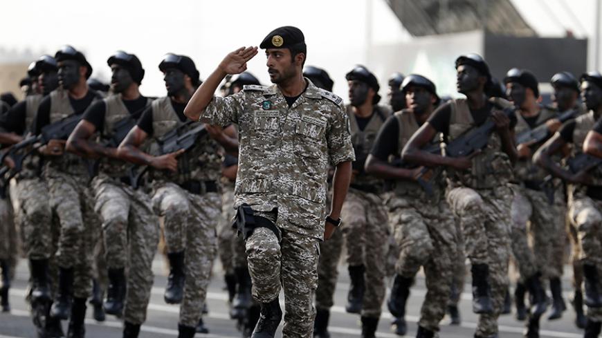 Members of the Saudi security forces take part in a military parade in preparation for the annual Haj pilgrimage in the holy city of Mecca September 28, 2014. REUTERS/Muhammad Hamed (SAUDI ARABIA- Tags: RELIGION MILITARY) - RTR482AN