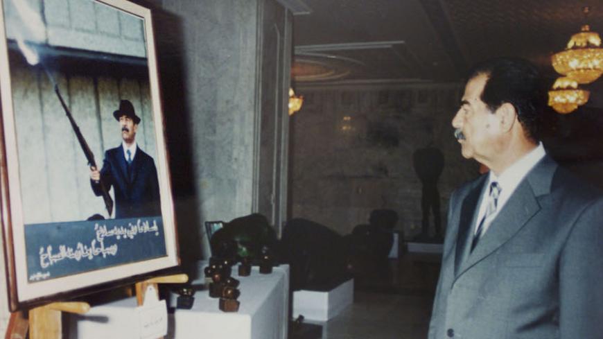Iraqi president Saddam Hussein admires a photograph of himself, presented to him by the Iraqi Information Ministry during an exhibition of gifts June 2001, presented to the Iraqi president for his birthday on April 28 2001. Picture taken June 2001.

fk/AA - RTRJZ1U