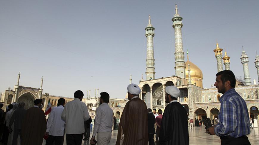 Men stand in line to vote during the Iranian presidential election at a mosque in Qom, 120 km (74.6 miles) south of Tehran June 14, 2013. Millions of Iranians voted to choose a new president on Friday, urged by Supreme Leader Ayatollah Ali Khamenei to turn out in force to discredit suggestions by arch foe the United States that the election would be unfair. REUTERS/Fars News/Mohammad Akhlagi  (IRAN - Tags: POLITICS ELECTIONS) ATTENTION EDITORS - THIS IMAGE WAS PROVIDED BY A THIRD PARTY. FOR EDITORIAL USE ON