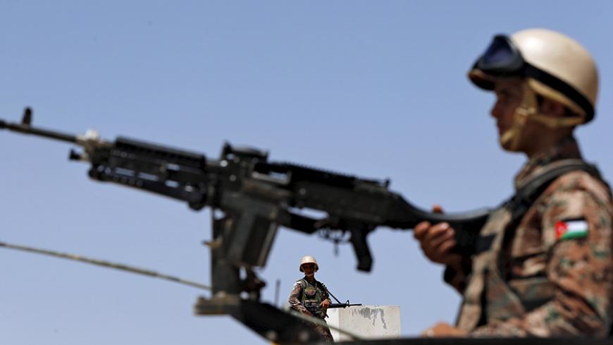 Soldiers stand guard at the Jordanian-Syrian border, near Mafraq, August 16, 2015. Commander of the Jordanian Border Guard, Brigadier General Saber Mahayrah, said on Sunday that there was no sign of Nusra Front or Islamist State fighters on the border between Jordan and Syria. REUTERS/Muhammad Hamed - RTX1OELU
