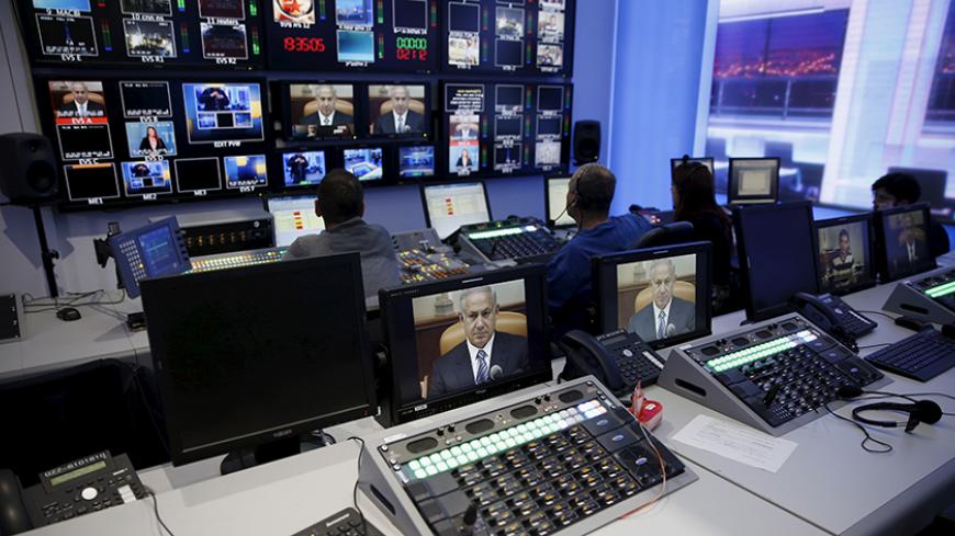 Israel's Prime Minister Benjamin Netanyahu is seen on monitors before the evening news bulletin at Channel 10's control room in Jerusalem November 18, 2015. Critics say Netanyahu, known as "Bibi," is hitting the wrong note when it comes to the media, weakening press freedom and holding sway over TV broadcasters in a country that bills itself as the Middle East's only true democracy. Picture taken November 18, 2015. To match Insight ISRAEL-NETANYAHU/MEDIA REUTERS/Ronen Zvulun - RTX1VG2J