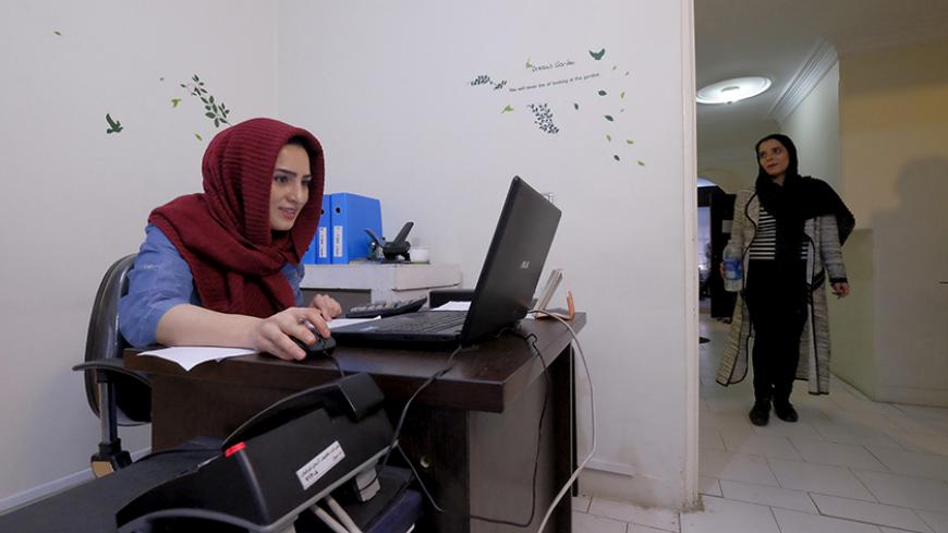 An employee works with her laptop at Takhfifan company in Tehran, Iran, January 19, 2016. REUTERS/Raheb Homavandi/TIMA ATTENTION EDITORS - THIS IMAGE WAS PROVIDED BY A THIRD PARTY. FOR EDITORIAL USE ONLY. - RTX2330Q