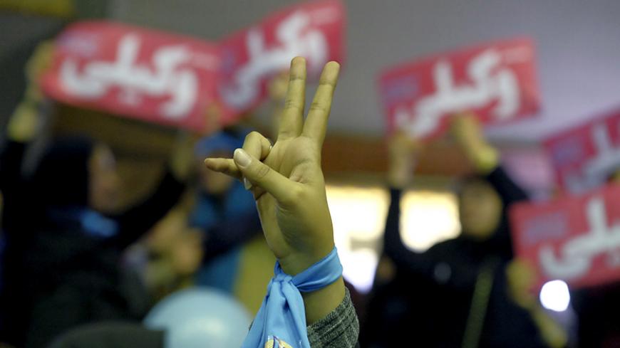 An Iranian woman gestures as she attends a reformist campaign for upcoming parliamentary election, in Tehran February 18, 2016. REUTERS/Raheb Homavandi/TIMA ATTENTION EDITORS - THIS IMAGE WAS PROVIDED BY A THIRD PARTY. FOR EDITORIAL USE ONLY. - RTX27K9Y