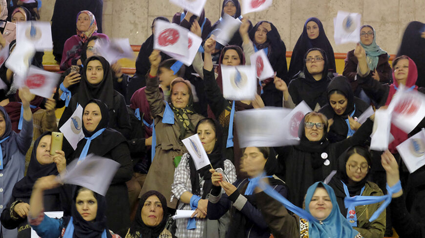 Iranian women holding electoral signs attend a reformist campaign for upcoming parliamentary election, in Tehran February 18, 2016. REUTERS/Raheb Homavandi/TIMA ATTENTION EDITORS - THIS IMAGE WAS PROVIDED BY A THIRD PARTY. FOR EDITORIAL USE ONLY. - RTX27KCQ