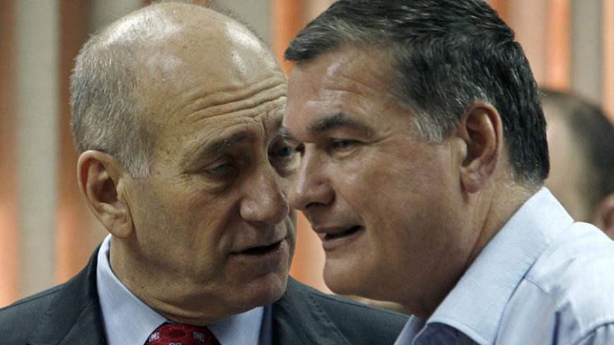 Israel's Prime Minister Ehud Olmert stands with Vice Premier Haim Ramon (R) before a Kadima party meeting at the parliament in Jerusalem July 7, 2008.
REUTERS/Ronen Zvulun (JERUSALEM) - RTX7Q36
